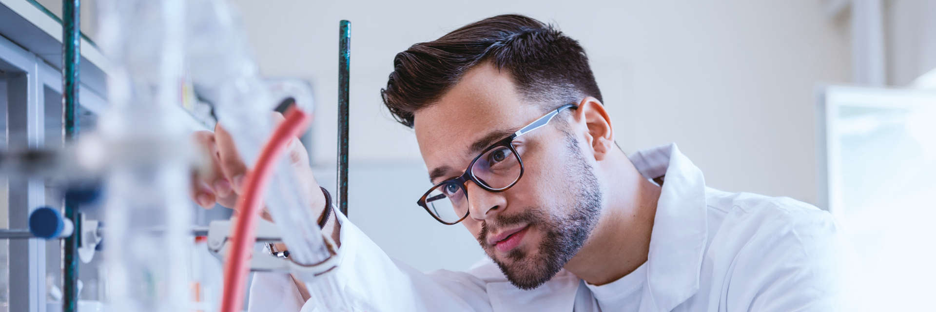 Enzymes, NGS, Male Caucasian scientist working with scientific equipment in a laboratory setting